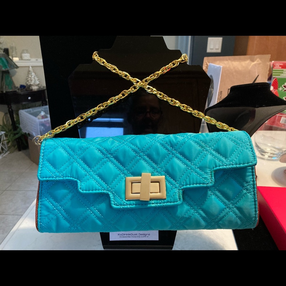 SONDRA ROBERTS quilted clutch with gold chain strap. Beautiful floral lining